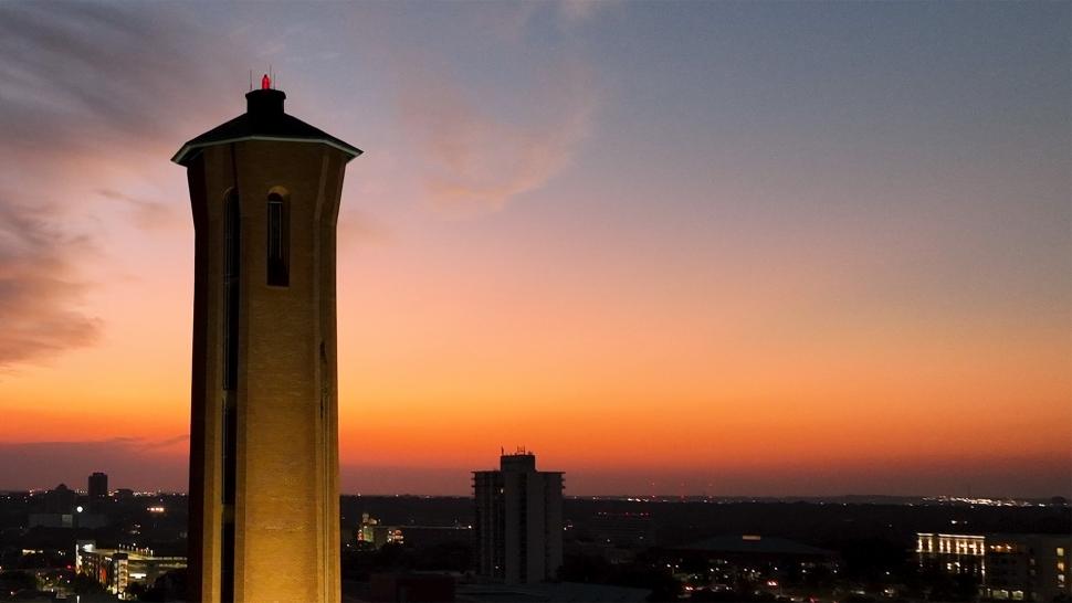 Trinity Tower with orange sunrise in background