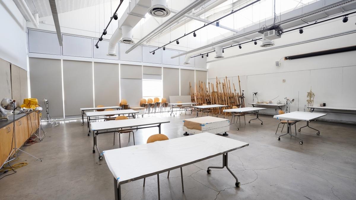 Empty studio with tables and lighting